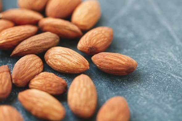 High cholesterol: Almonds and salmon are two foods to help ...